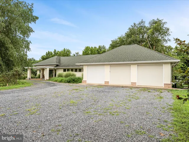 a kitchen with stainless steel appliances granite countertop wooden floors and granite counter tops