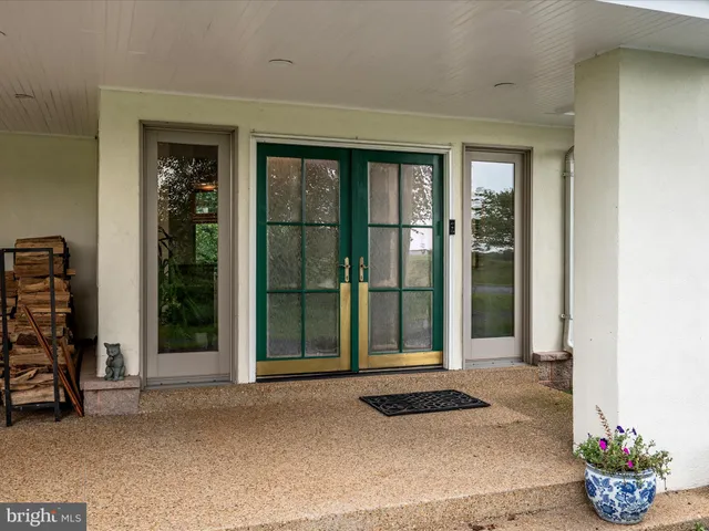 a living room with fireplace furniture and a flat screen tv