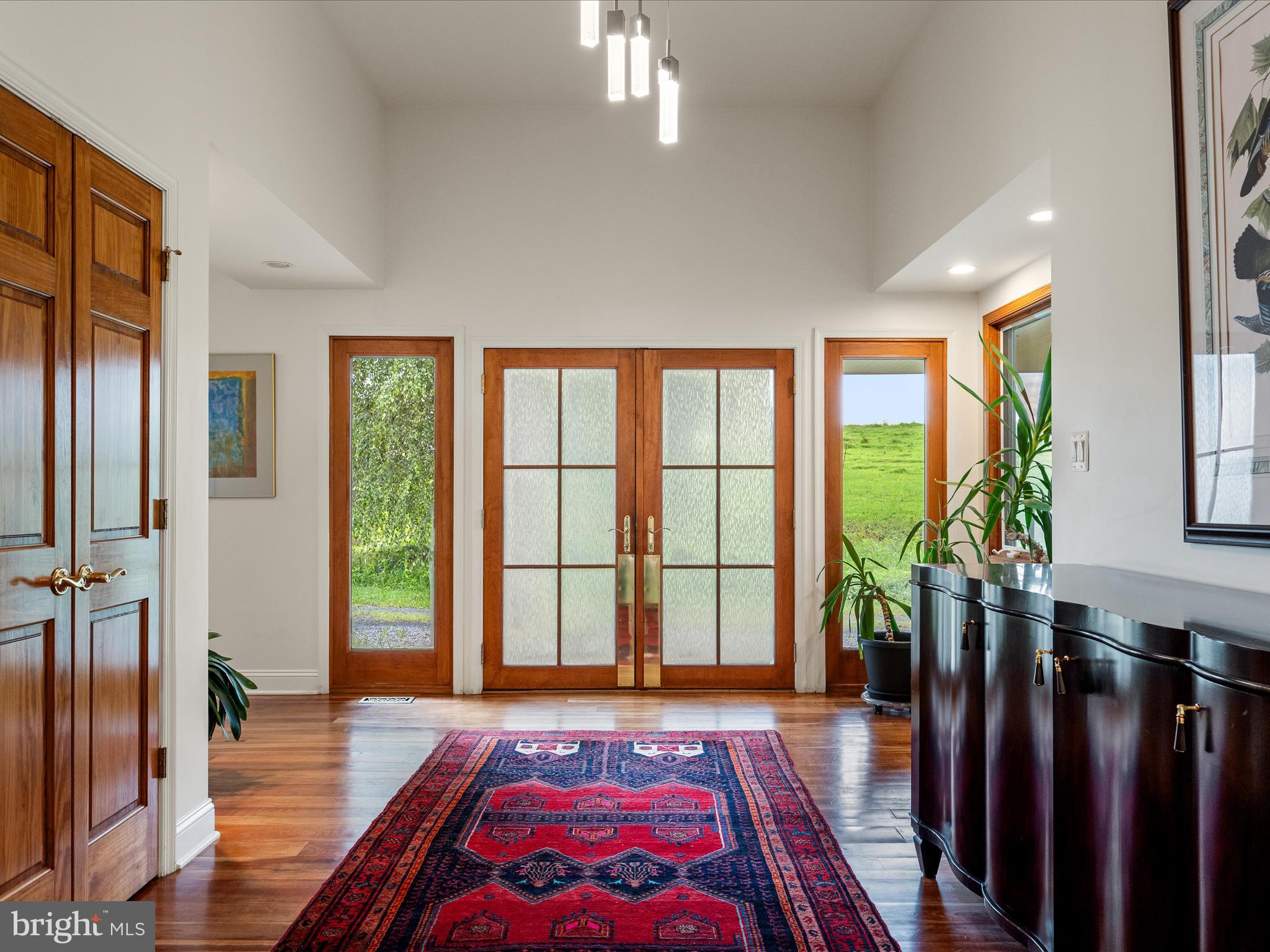3959 Cobbler Mountain Road Delaplane, VA 20144 - Photo 17 of 106 a room with lots of large windows and wooden floor