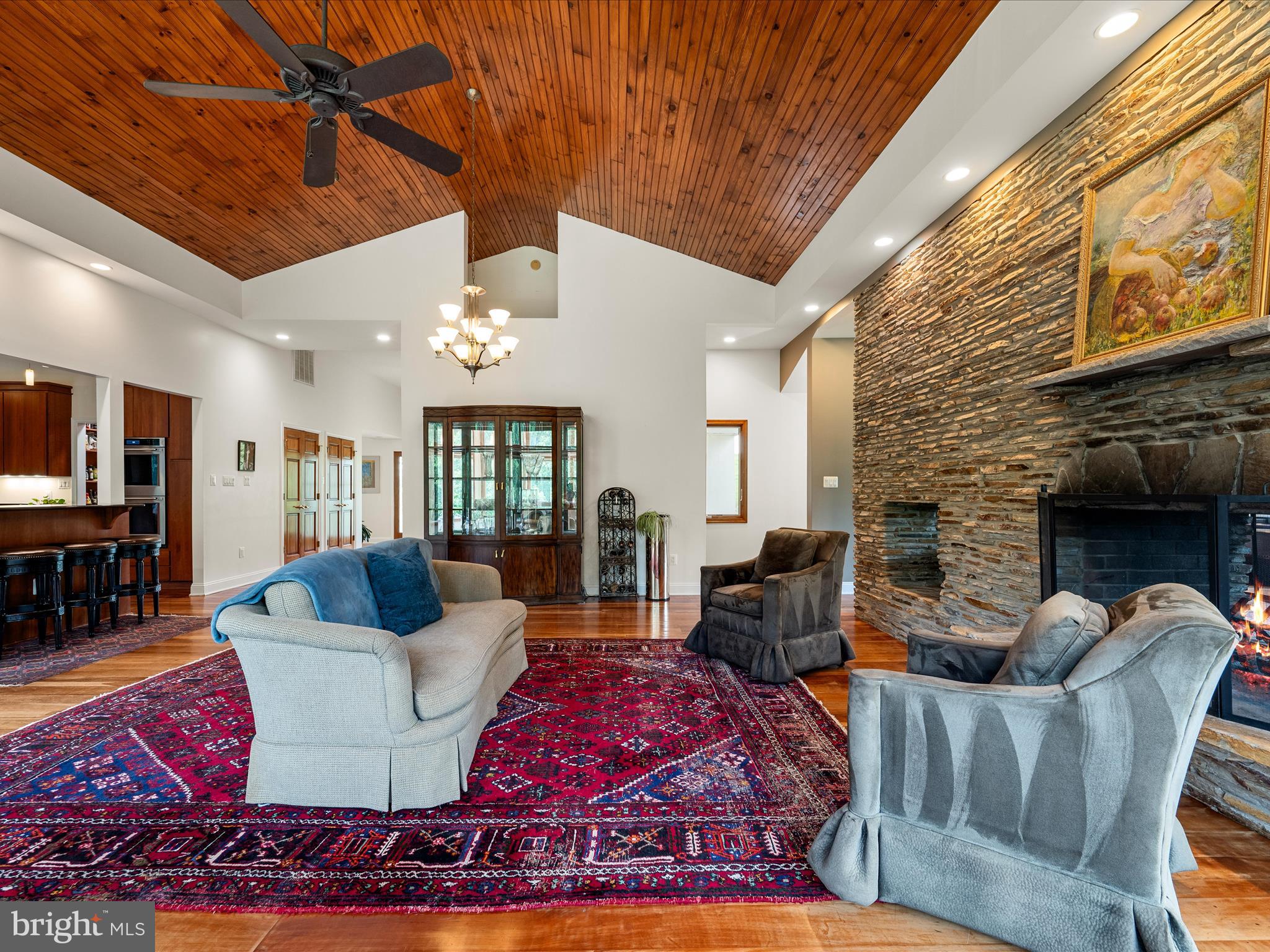 3959 Cobbler Mountain Road Delaplane, VA 20144 - Photo 21 of 106 a living room with furniture a fireplace and a ceiling fan