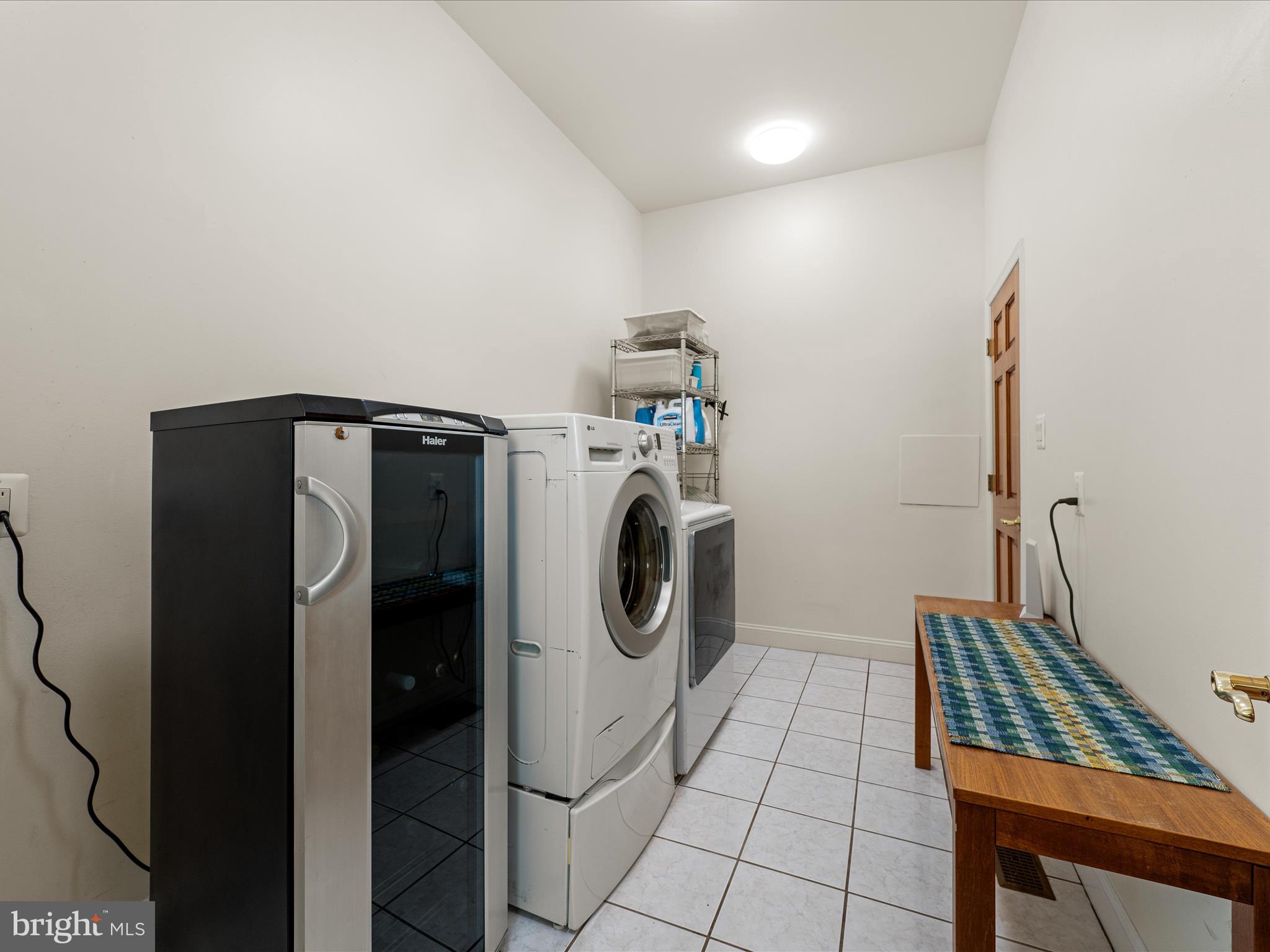 3959 Cobbler Mountain Road Delaplane, VA 20144 - Photo 42 of 106 a utility room with dryer and washer