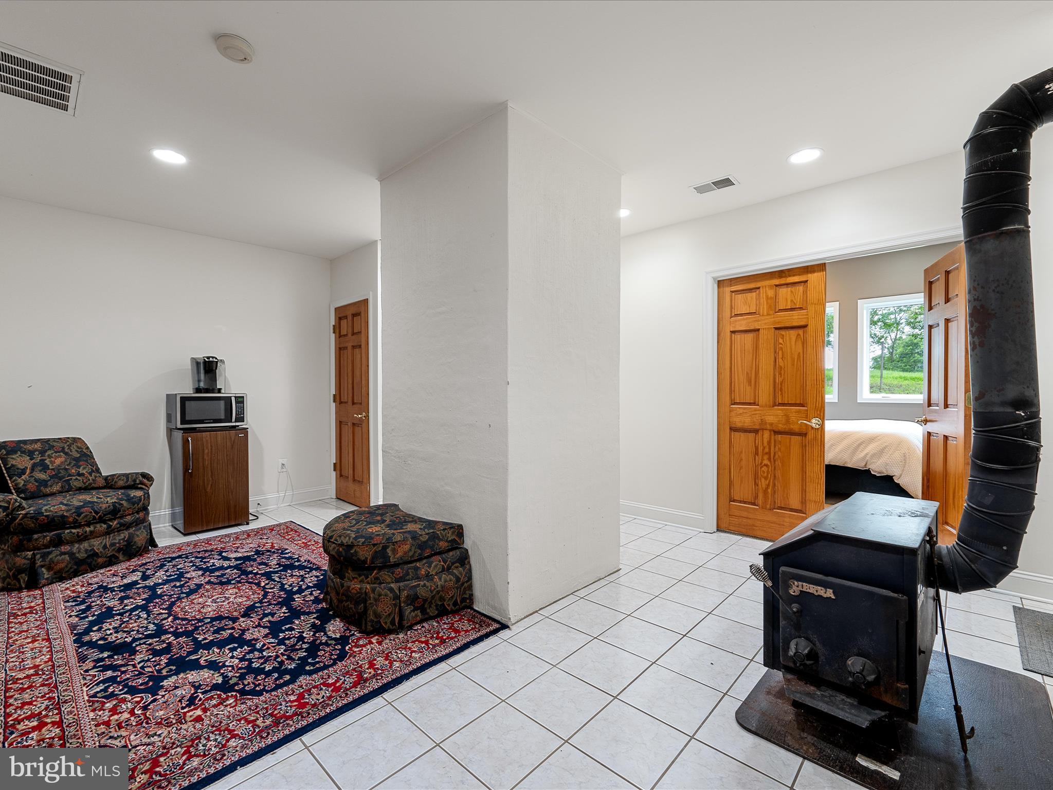 3959 Cobbler Mountain Road Delaplane, VA 20144 - Photo 56 of 106 a bedroom with furniture and a window