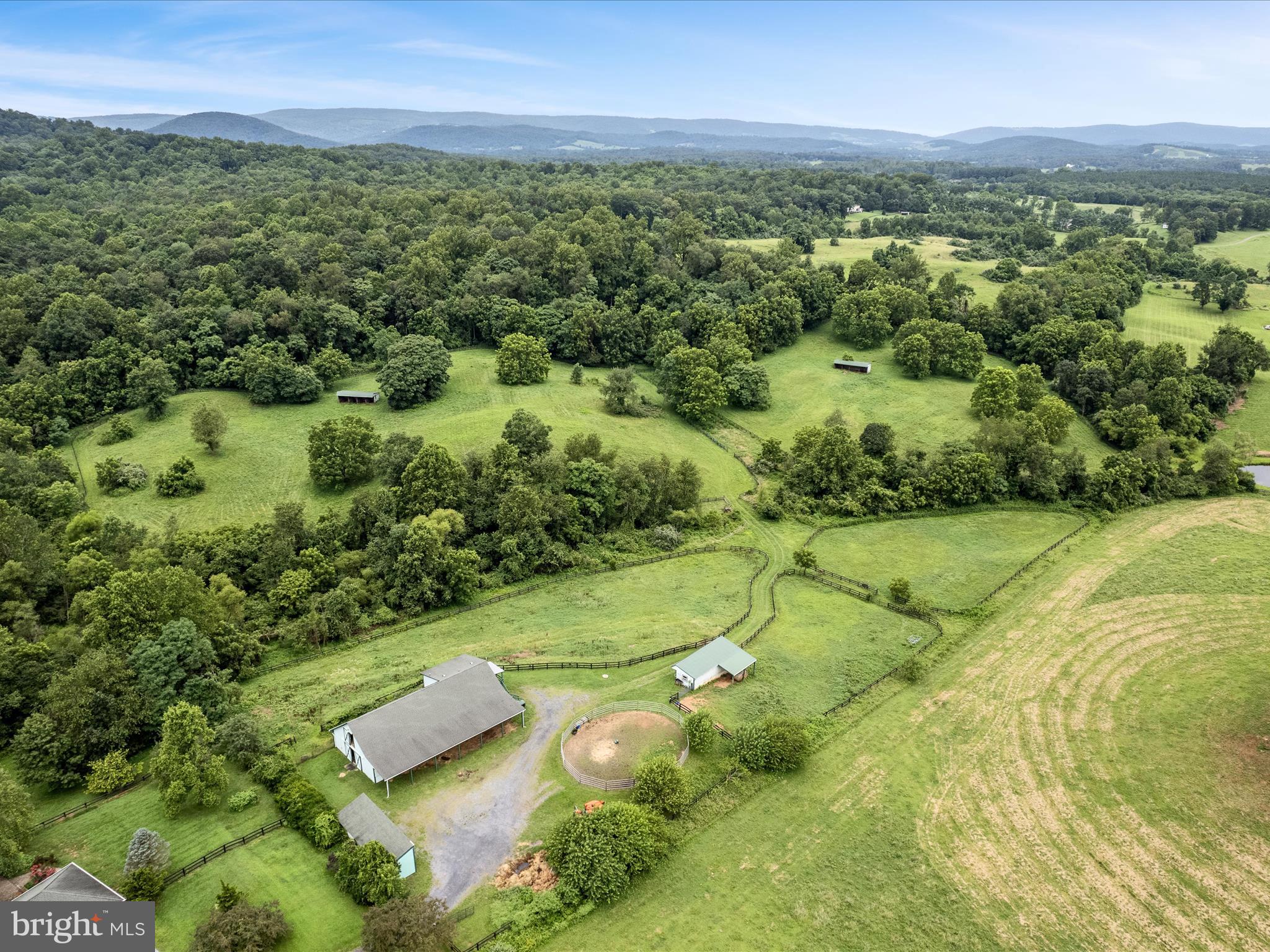 3959 Cobbler Mountain Road Delaplane, VA 20144 - Photo 98 of 106 a view of a city with lush green forest