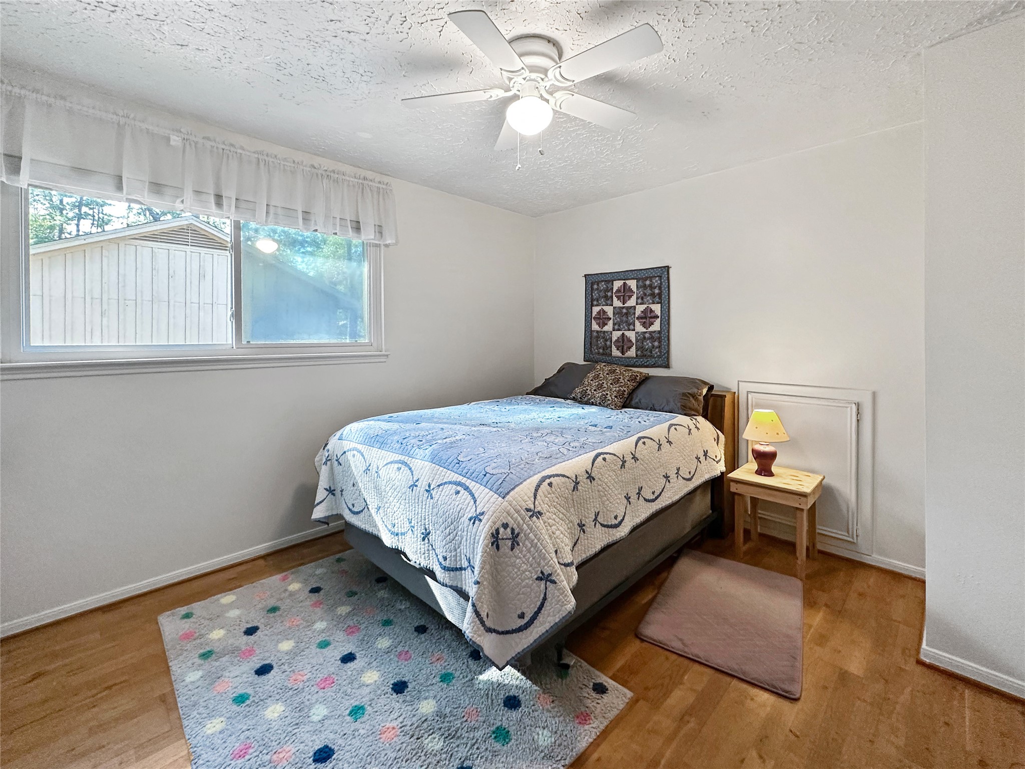 17423 Fairway Oaks Drive Spring, TX 77379 - Photo 17 of 50 a bedroom with a bed and a window