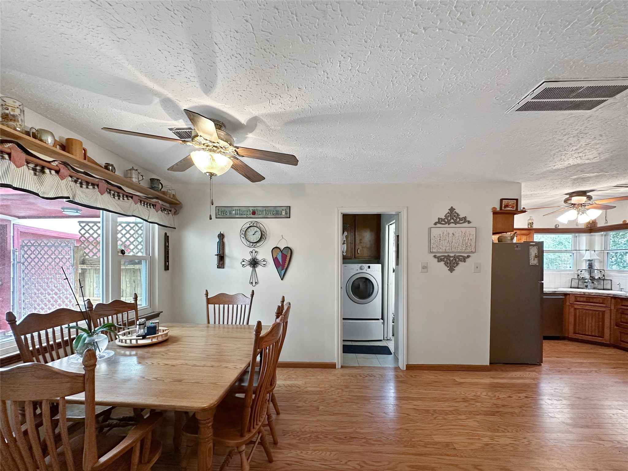 17423 Fairway Oaks Drive Spring, TX 77379 - Photo 9 of 50 BREAKFAST AREA IS OPEN TO KITCHEN AND NEAR LIVING ROOM. This kitchen boasts ample counter space and cabinetry, offering the perfect setup for meal prep, hosting, or casual family dining.