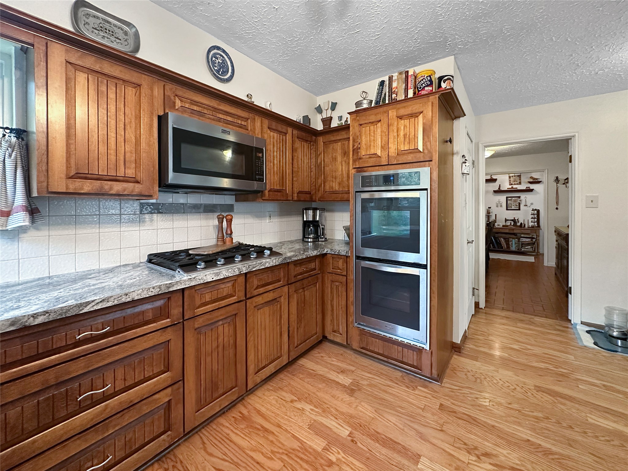 17423 Fairway Oaks Drive Spring, TX 77379 - Photo 10 of 50 a kitchen with stainless steel appliances granite countertop a stove microwave and sink