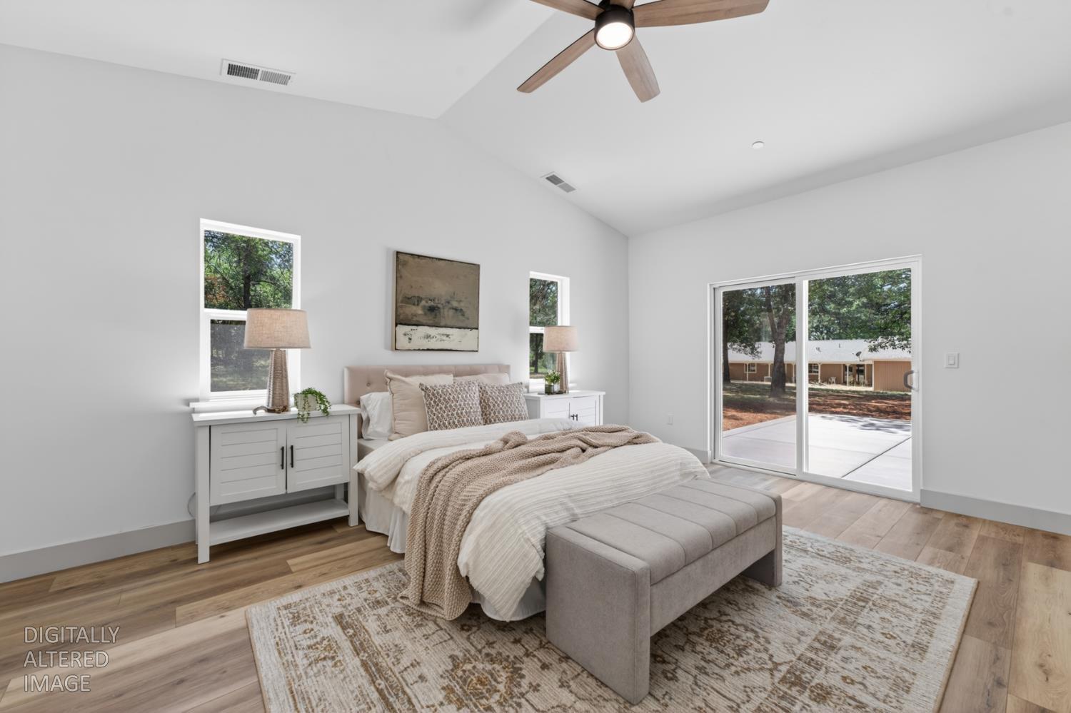 280 Jan Road Grass Valley, CA 95945 - Photo 23 of 66 a spacious bedroom with a large bed and a window