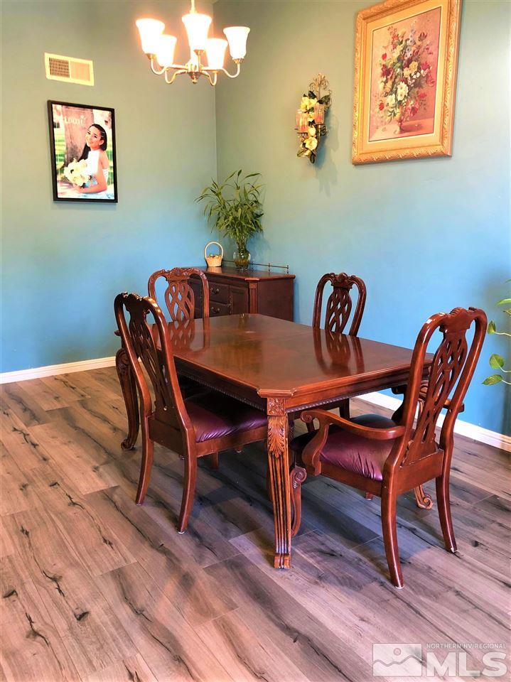 5220 Ural Street Reno, NV 89506 - Photo 4 of 19 a view of a dining room with furniture and wooden floor