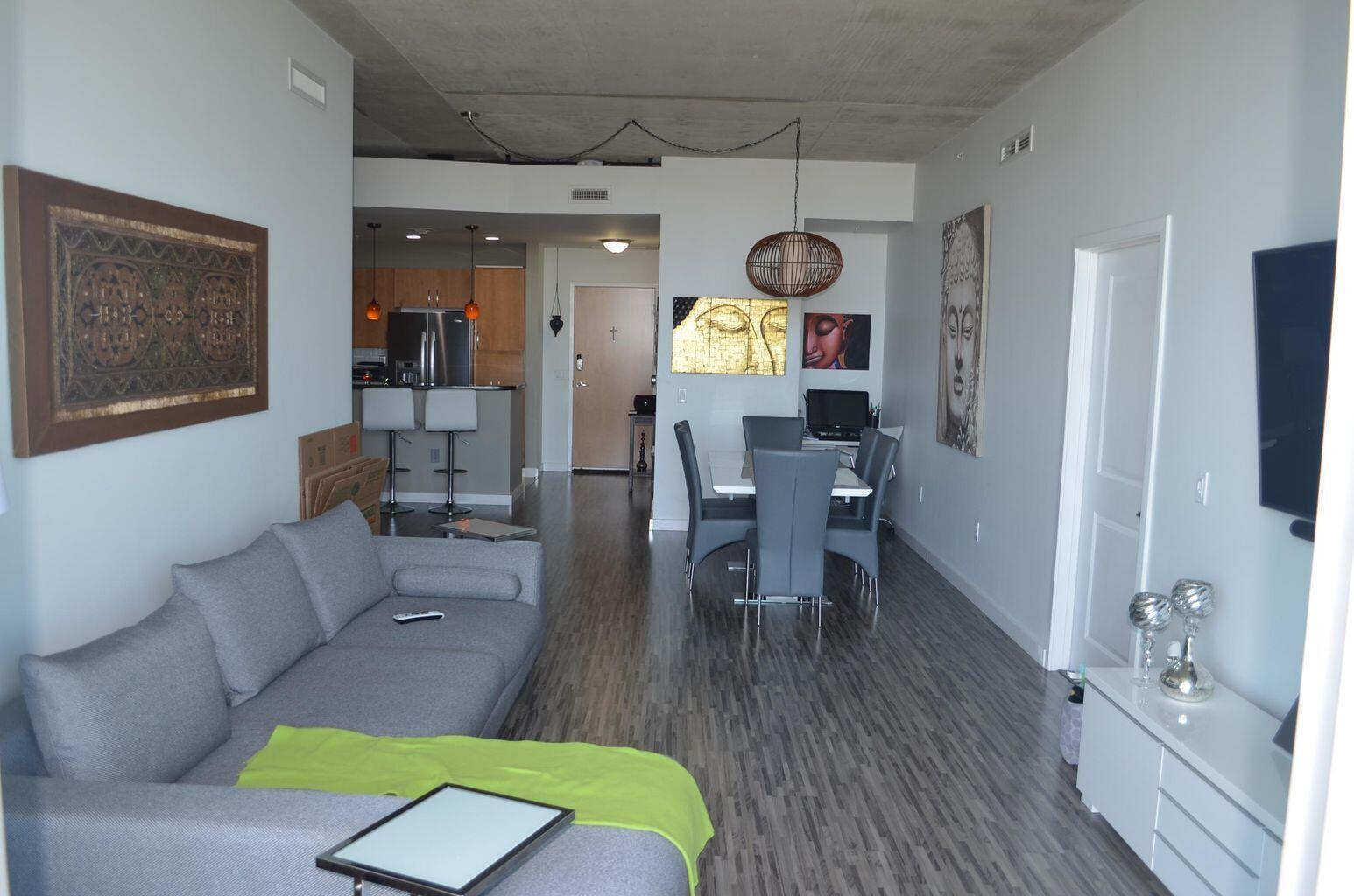 300 South Australian Avenue, Unit 1504 West Palm Beach, FL 33401 - Photo 14 of 27 a living room with furniture and a wooden floor