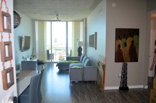 a living room with furniture and a large window