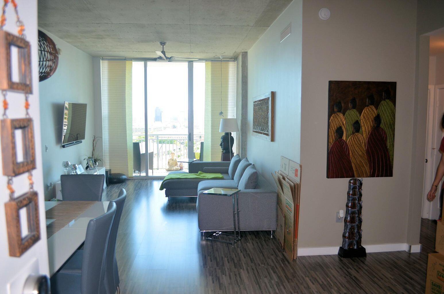 300 South Australian Avenue, Unit 1504 West Palm Beach, FL 33401 - Photo 16 of 27 a living room with furniture and a large window