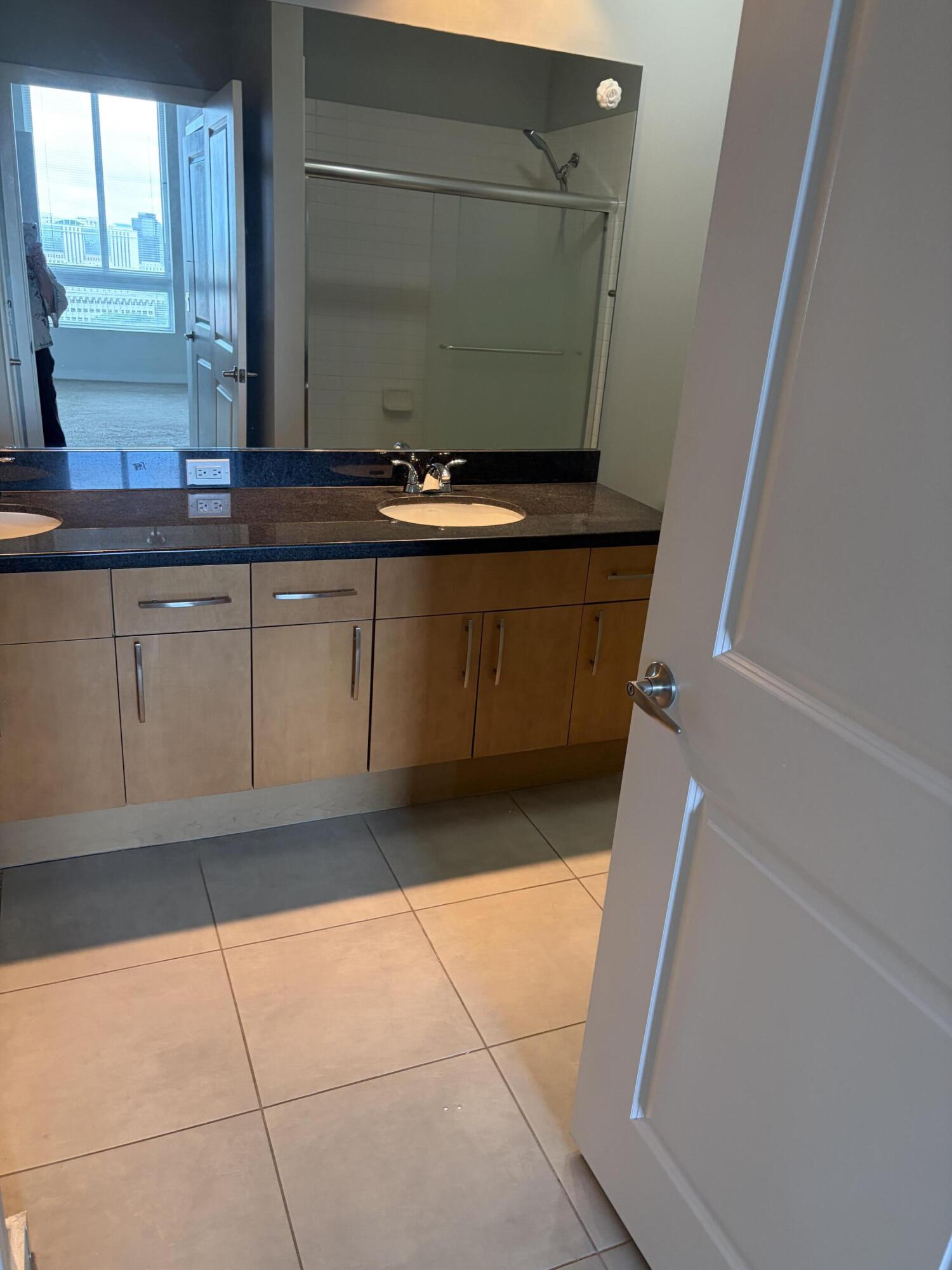 300 South Australian Avenue, Unit 1504 West Palm Beach, FL 33401 - Photo 18 of 27 a view of kitchen with granite countertop cabinets