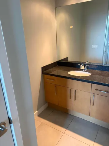 a bathroom with a sink and vanity