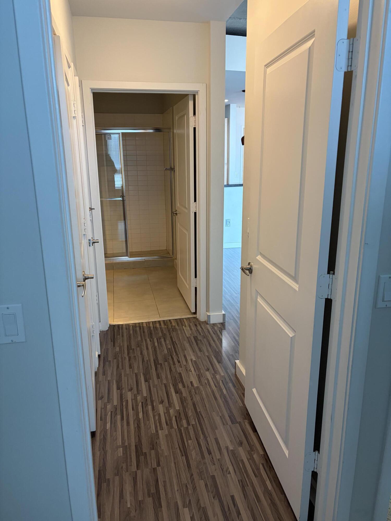 300 South Australian Avenue, Unit 1504 West Palm Beach, FL 33401 - Photo 23 of 27 a view of a hallway with wooden floor