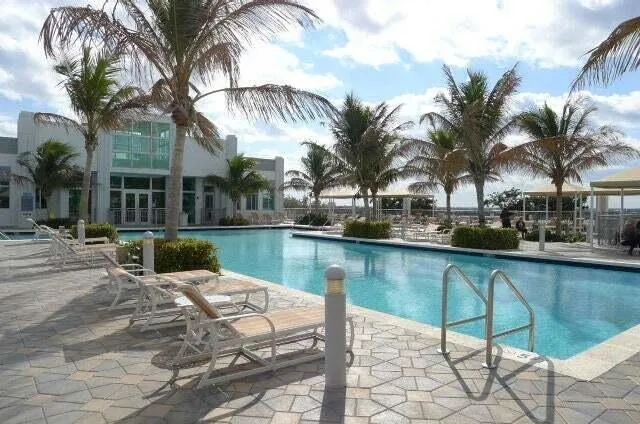 a view of a swimming pool with a table and chairs