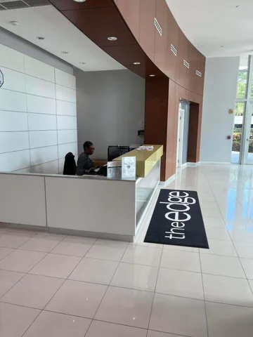 a room with a couch a rug and a stove top oven