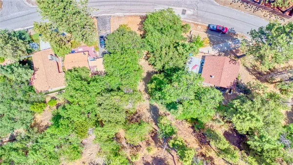 an aerial view of a house with a yard and garden