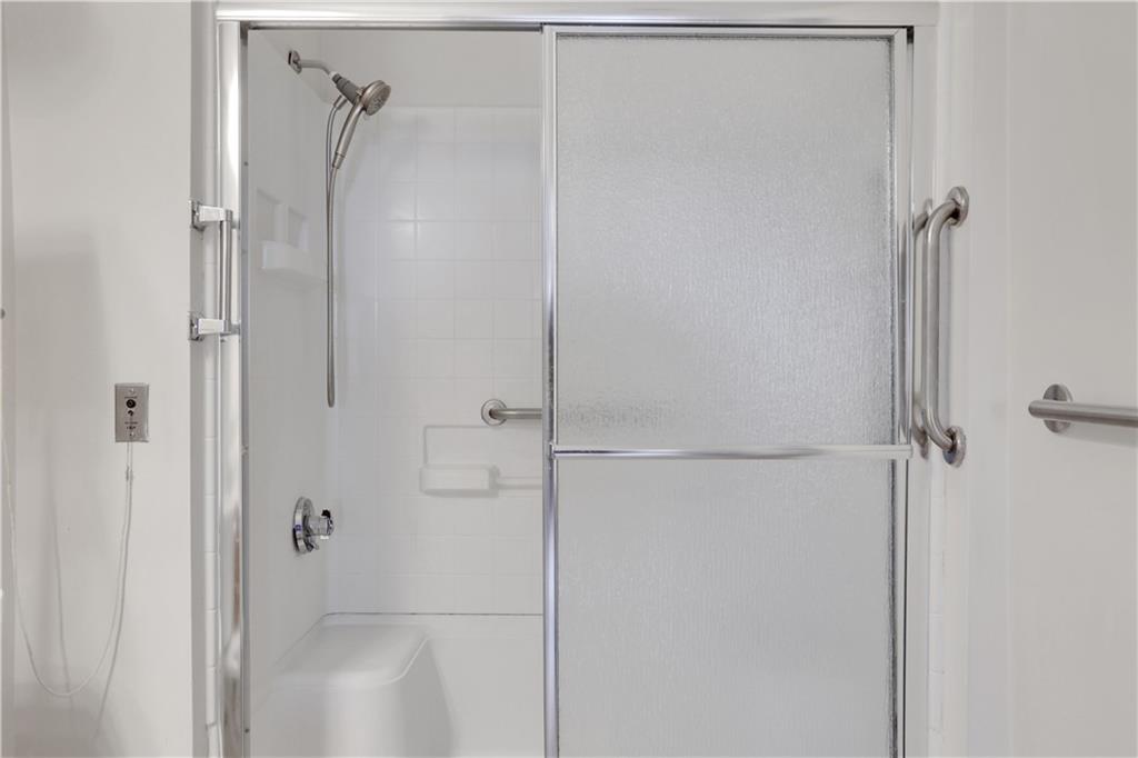 300 Johnson Ferry Road, Unit B1002 Sandy Springs, GA 30328 - Photo 16 of 26 a bathroom with a glass shower door