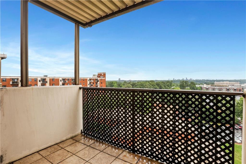 300 Johnson Ferry Road, Unit B1002 Sandy Springs, GA 30328 - Photo 19 of 26 a view of roof deck with wooden fence