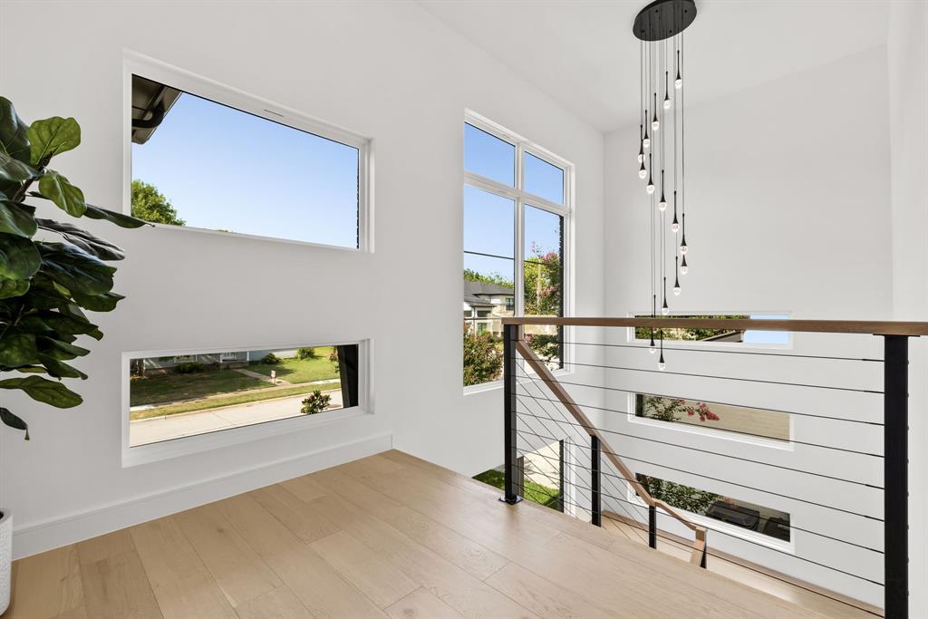 4322 Sexton Lane Dallas, TX 75229 - Photo 17 of 37 Beautiful natural lit floating stairwell.