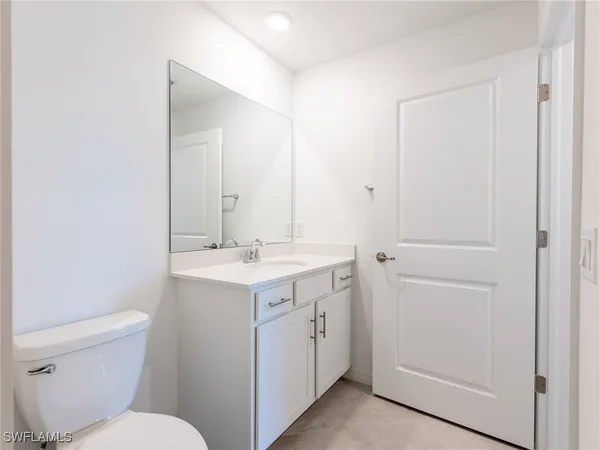 a kitchen with stainless steel appliances granite countertop a stove a sink a refrigerator a microwave and cabinets