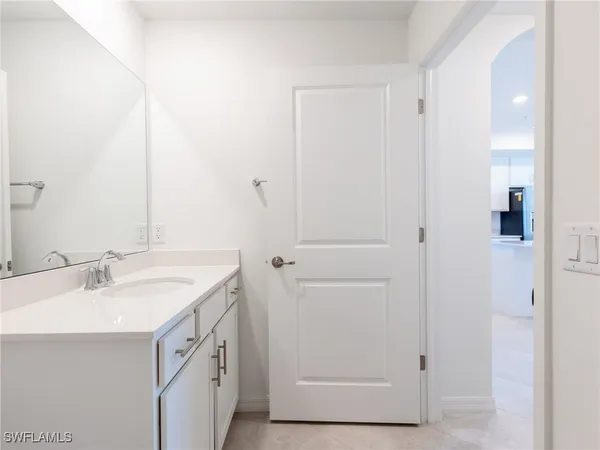 a kitchen with cabinets stainless steel appliances and a sink