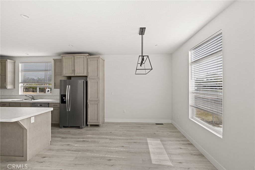 33064 Willard Street Winchester, CA 92596 - Photo 15 of 34 a view of a kitchen with refrigerator and windows