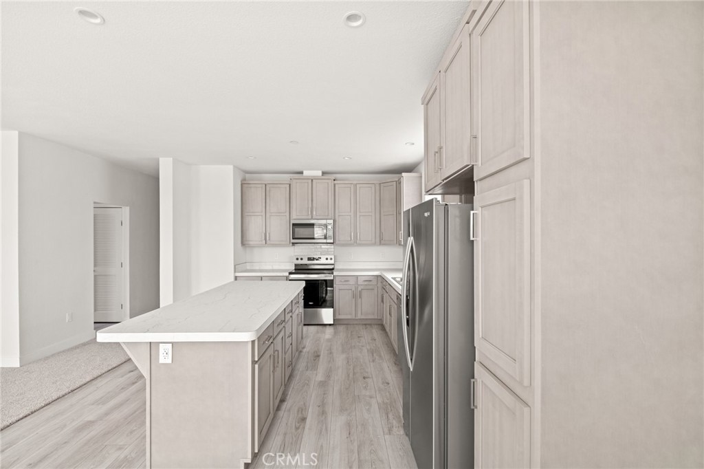 33064 Willard Street Winchester, CA 92596 - Photo 17 of 34 a kitchen with stainless steel appliances a refrigerator and a stove