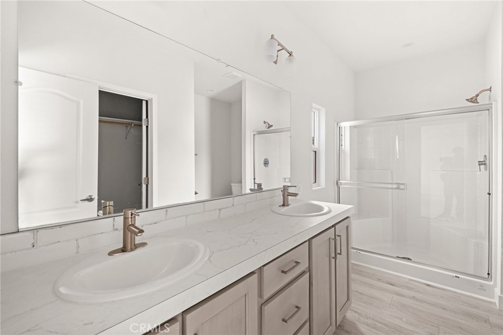 33064 Willard Street Winchester, CA 92596 - Photo 26 of 34 a bathroom with a sink and a mirror
