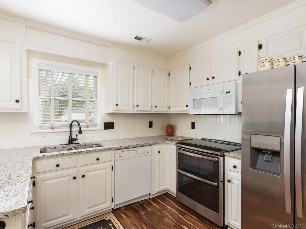 1527 Cobblestone Court, Unit 27A Fort Mill, SC 29708 - Photo 14 of 30 a kitchen with white cabinets and appliances
