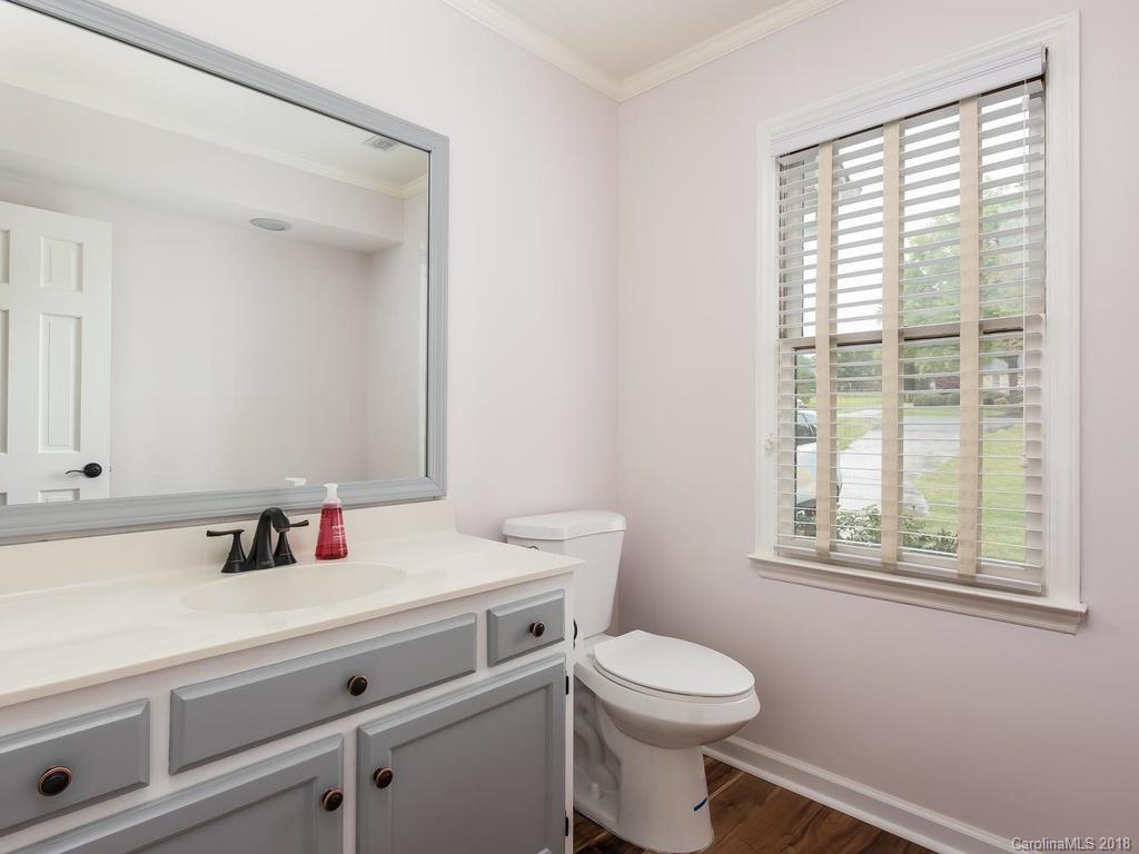 1527 Cobblestone Court, Unit 27A Fort Mill, SC 29708 - Photo 17 of 30 a bathroom with a sink a toilet and a window