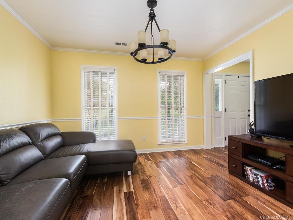 1527 Cobblestone Court, Unit 27A Fort Mill, SC 29708 - Photo 19 of 30 a living room with furniture and a flat screen tv