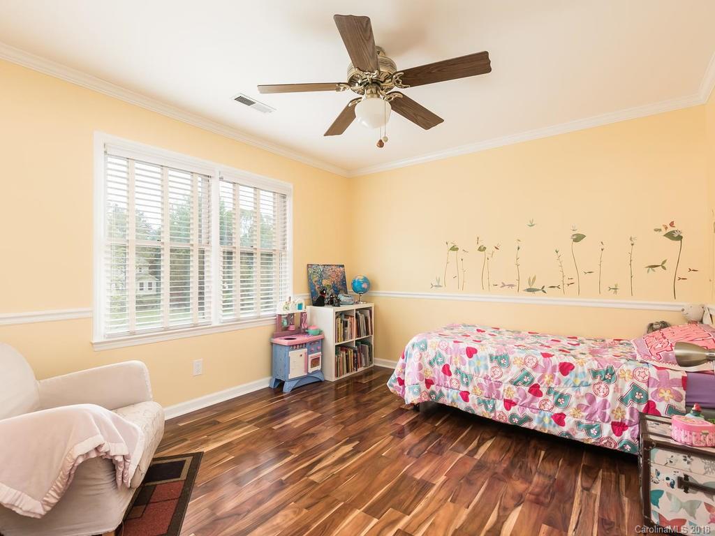 1527 Cobblestone Court, Unit 27A Fort Mill, SC 29708 - Photo 23 of 30 a bedroom with furniture and a window