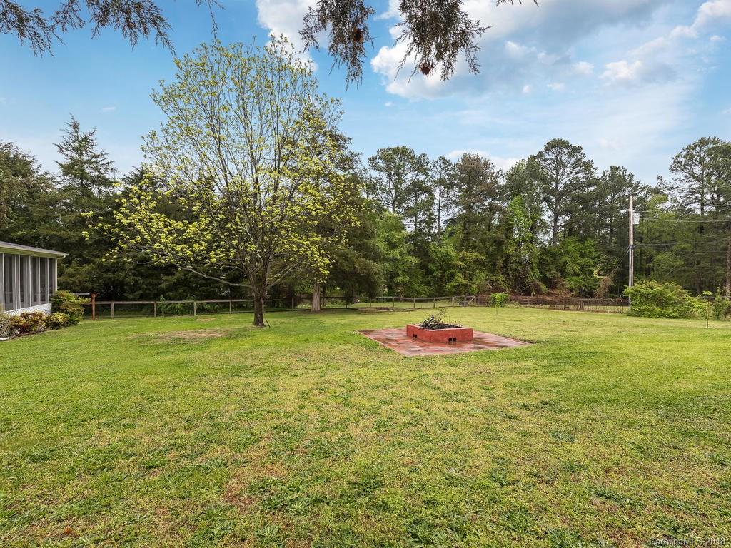 1527 Cobblestone Court, Unit 27A Fort Mill, SC 29708 - Photo 30 of 30 a view of pool and trees in the background