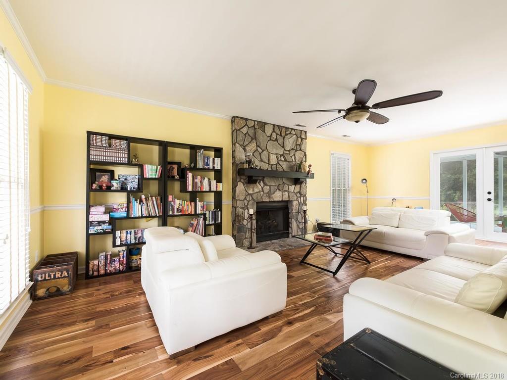 1527 Cobblestone Court, Unit 27A Fort Mill, SC 29708 - Photo 5 of 30 a living room with furniture a fireplace and a large window