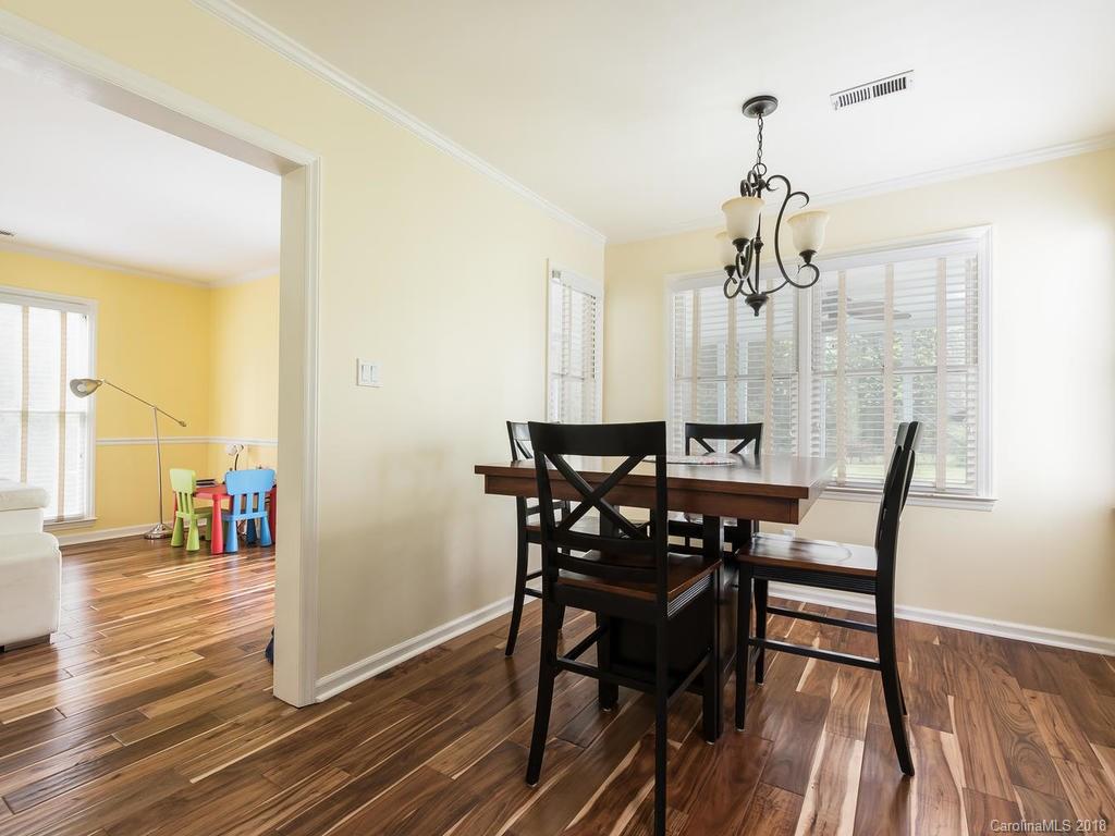 1527 Cobblestone Court, Unit 27A Fort Mill, SC 29708 - Photo 10 of 30 a view of a dining room with furniture and wooden floor