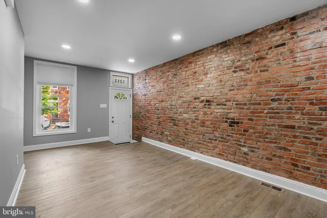 a view of an empty room and a window