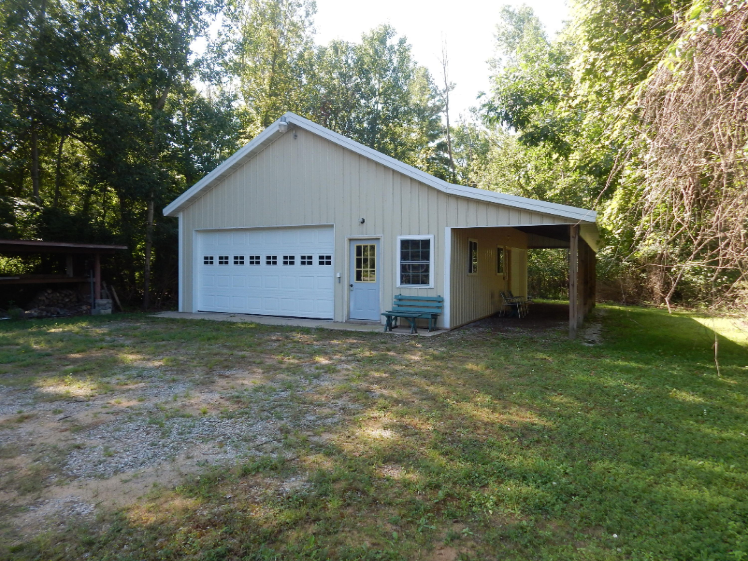 5595 8 Mile Road Onekama, MI 49675 - Photo 1 of 15 Lean-to is a bonus feature!