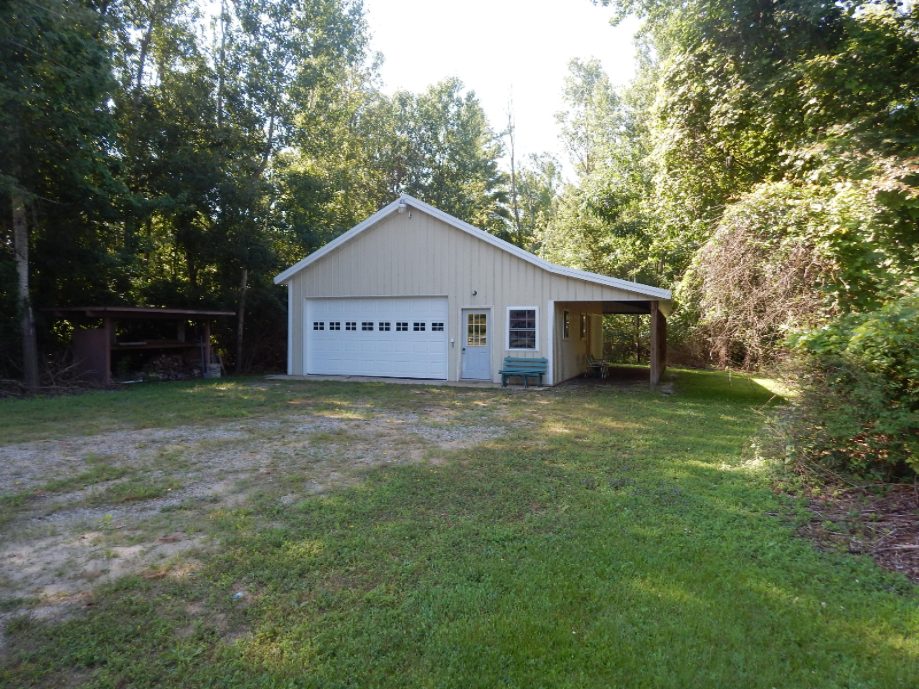 5595 8 Mile Road Onekama, MI 49675 - Photo 11 of 15 Fish cleaning area to left of bldg