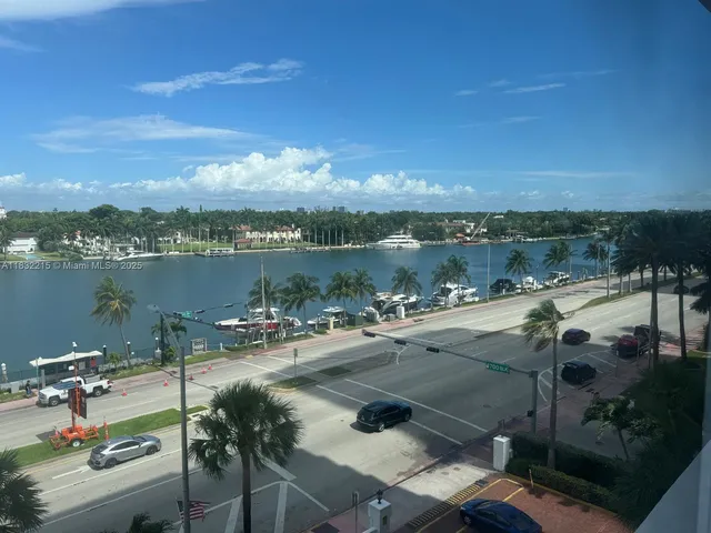 a view of a lake with couches and city view