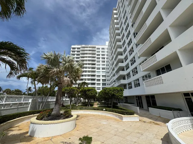 a view of a building with a swimming pool