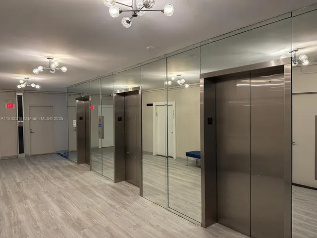a bathroom with a shower and a glass door