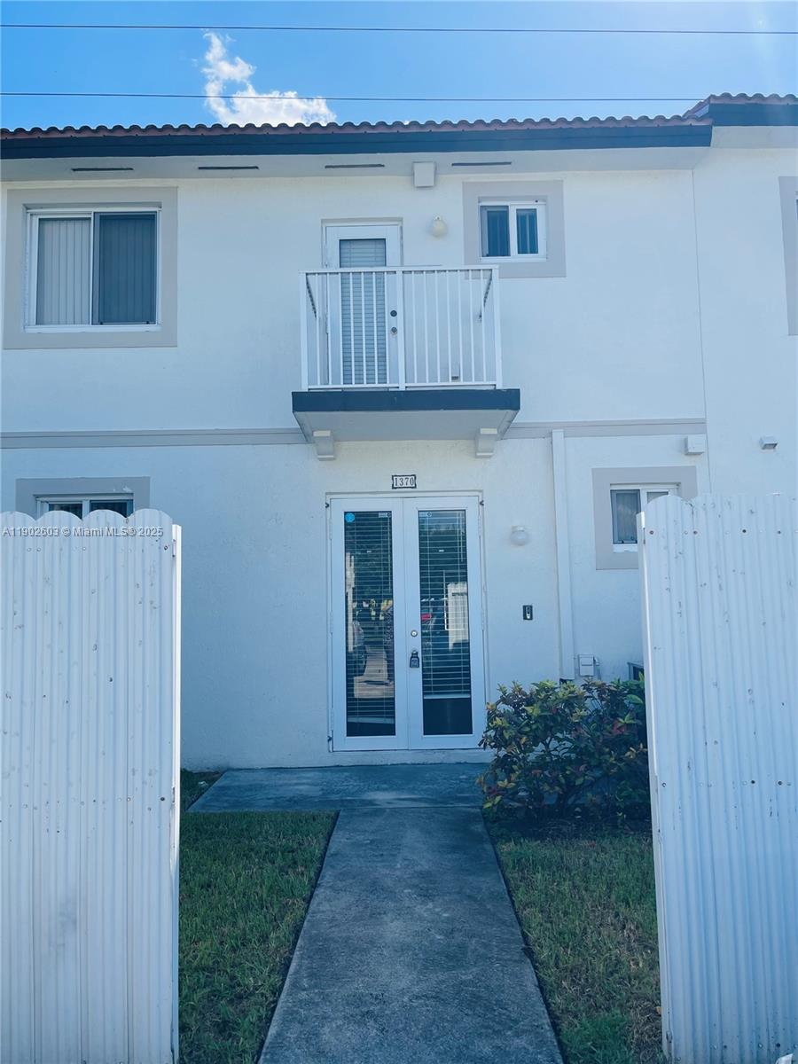 1370 West 30th Street, Unit 1370 Hialeah, FL 33012 - Photo 1 of 23 a view of a house with a wooden door