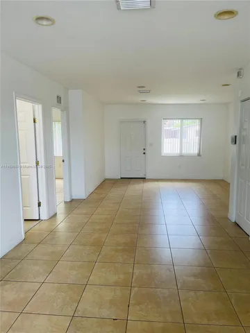 a view of an empty room and window