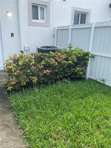 a view of a backyard with plants