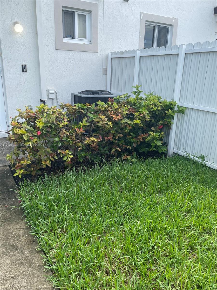 1370 West 30th Street, Unit 1370 Hialeah, FL 33012 - Photo 2 of 23 a view of a backyard with plants