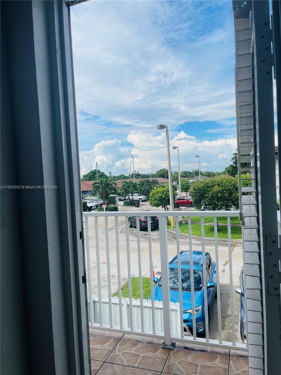 1370 West 30th Street, Unit 1370 Hialeah, FL 33012 - Photo 22 of 23 a balcony with with a lake view