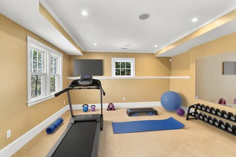 a bedroom with furniture and a window