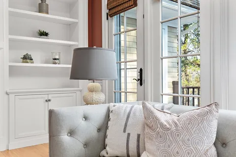 a bedroom with a bed and with chair