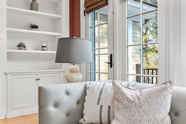 a bedroom with a bed and with chair